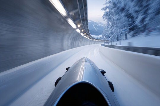 Bobsled approaching the bend in a snowy winter track