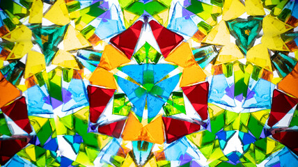 Vibrant macro photography of a natural kaleidoscope pattern, captured on camera. Bright, geometric abstract design with intense colors and light.