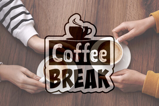 Coffee break time. Colleagues with cups of cappuccino at table, top view