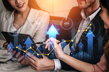 Business professionals analyze financial data on a tablet while discussing growth trends and analytics in a modern office setting, showcasing teamwork and strategy. Scalp