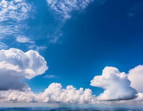 fluffy cumulus clouds against a vivid blue sky