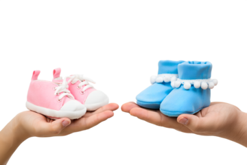 Hands cradling miniature pink and blue baby booties, representing the joy of pregnancy announcement and the anticipation of gender reveal