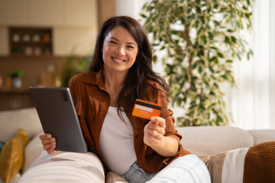 Woman shopping online with digital tablet and credit card