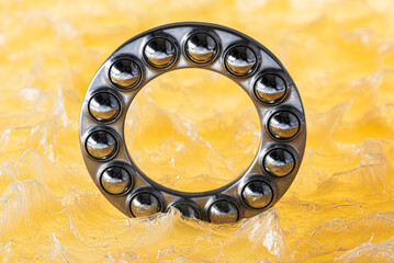 Ball bearing immersed in grease, close-up view