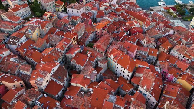 Cinematic Aerial View of Rovinj Old Town, Croatia &ndash; Golden Sunset Over Adriatic Sea with Red Rooftops, Historic Architecture and Peaceful Mediterranean Atmosphere