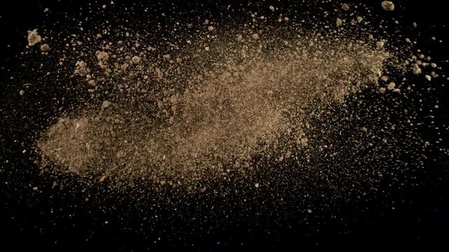 Super Slow Motion of Soil Colliding with Each Other Isolated on Black at 1000fps.