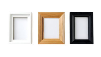 Three empty picture frames in white, wood, and black finishes on white background