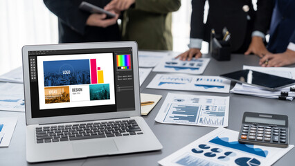 Graphic designer software for modern design of web page and commercial brisk ads showing on the computer screen