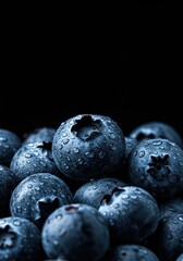 A close-up of vibrant, plump blueberries glistening with dew, ready for a healthy snack or delicious recipe ingredient ,produce ,farm fresh ,sour