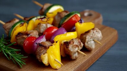 Colorful grilled skewers on wooden board, vibrant mix of vegetables and meat evokes summer barbecues, perfect for festive gatherings or healthy meals