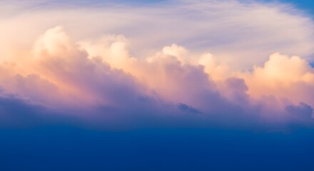 Naklejka premium Dramatic colorful sky with pink and orange pastel clouds in sunset over blue horizon