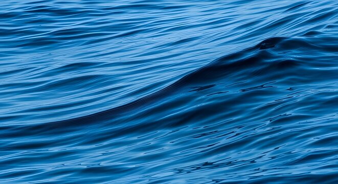 Gentle wave patterns on ocean surface creating abstract blue texture for peaceful summer - Powered by Adobe