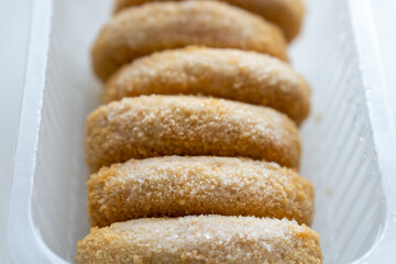 frozen cutlets on the light background, semi-finished product
