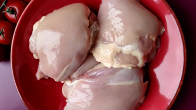 Chicken thigh fillet, skinless and boneless meat for grilling or barbecue. Chicken thigh fillet