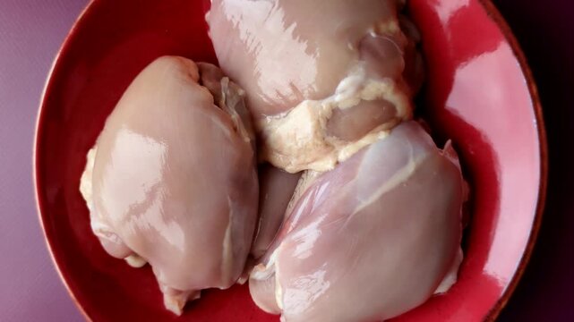 Chicken thigh fillet, skinless and boneless meat for grilling or barbecue. Chicken thigh fillet