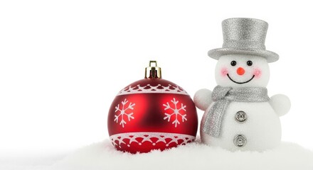 Cheerful snowman and shiny red bauble in fresh winter snow