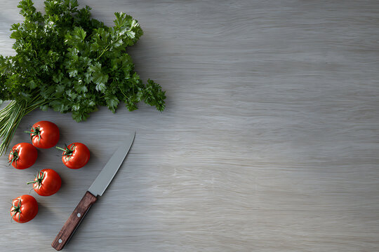 Fresh organic cherry tomatoes and a bunch of parsley arranged with a kitchen knife on a rustic wooden table for healthy cooking preparation