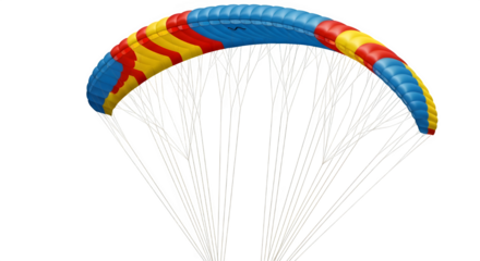 A paraglider with a blue, red, and yellow canopy soars against an