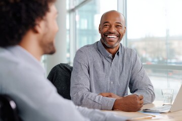 Smiling business leaders collaborating at an office table, capturing teamwork, diversity, and professional growth in a corporate meeting.