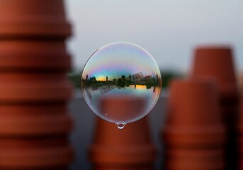 Soap Bubble Reflecting a City Skyline at Sunset reflection iridescent
