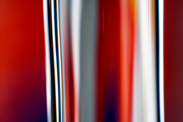 Close-up of flowing water stream reflecting vibrant colors