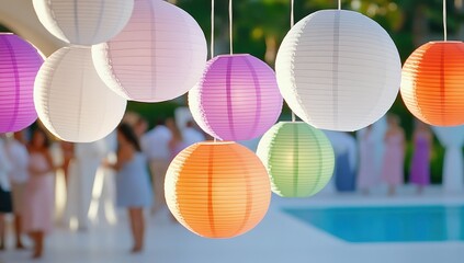 Colorful paper lanterns illuminate a summer garden party, creating a festive and cheerful atmosphere
