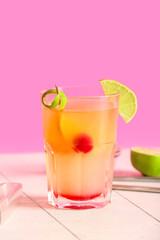Glass of tasty mai tai cocktail on table