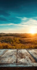 Rustic wooden surface in golden hour light over a field.