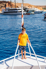 a boy on a yacht at sea