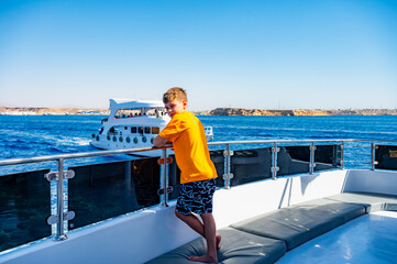 a boy on a yacht at sea