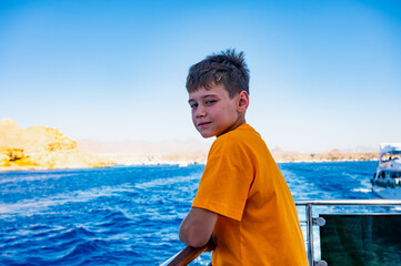 a boy on a yacht at sea