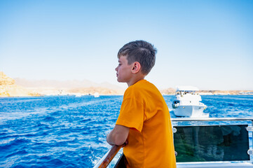 a boy on a yacht at sea