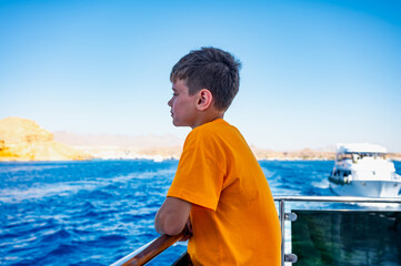 a boy on a yacht at sea