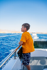 a boy on a yacht at sea