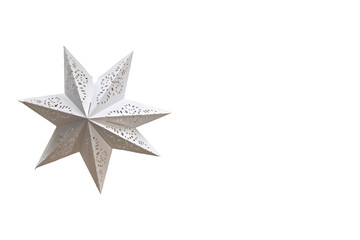 White decorative star on white background. Minimalist image of a white decorative star with cutout details isolated on a clean white background. Elegant and modern Christmas ornament ideal for design