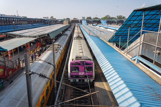 Delhi, India - September 15, 2025: Trains and people on the railway platform at New Delhi Railway Station