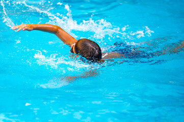 happy boy swimming in the pool