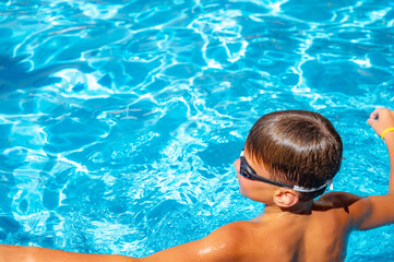 happy boy swimming in the pool