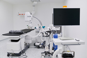 Modern medical examination room equipped with advanced imaging technology and tools for patient diagnostics