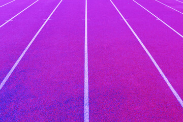 Red running track with white marking lines.