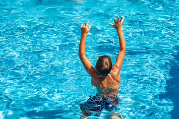 happy boy swimming in the pool