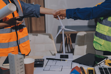 Architects and engineers working collaboratively on construction project