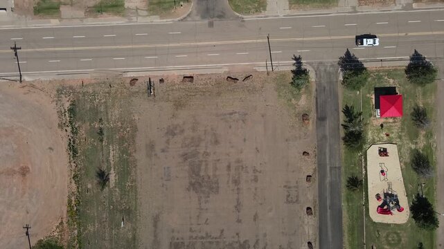 Aerial top down of remote desert town road historic route 66 midpoint Adrian Texas TX