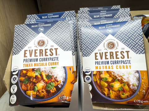 Villach, Austria - November 12, 2025: Everest premium currypaste boxes displayed in a grocery store, featuring Tikka Masala and Madras Curry flavors with vibrant packaging design