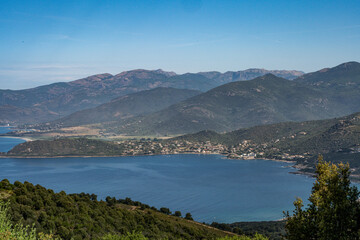 Fototapeta premium Spectacular view Golf at Sagone Corsica France beautyful sand Beach boats mountain village Tourism and vacations concept