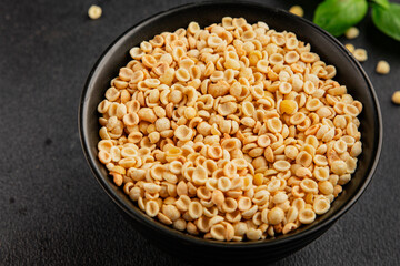 Orecchiette small pasta drum wheat pasta Italian food tasty snack fresh delicious gourmet food table setting rustic top view copy space