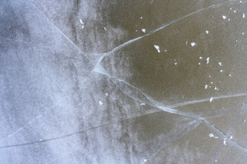 The textured rough crushed cold frosty surface of the ice block background.