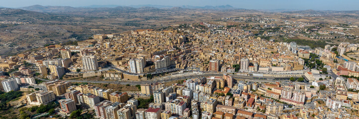 Naklejka premium Panoramic aerial view of the historic center of Agrigento, Sicily, Italy. This Sicilian capital was known in ancient times as Akragas. It's a beautiful, sunny summer day.