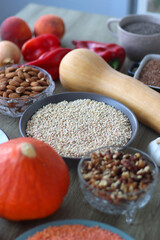 Assortment of various healthy fruits, vegetables, grains and legumes. Selective focus, wooden background.