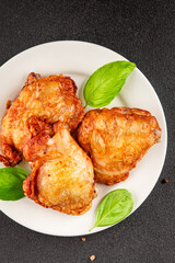 Chicken thighs fried poultry meat dish natural product tasty snack fresh delicious gourmet food background on the table rustic top view copy space